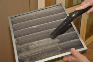 Cleaning an air filter for a furnace or air conditioner.